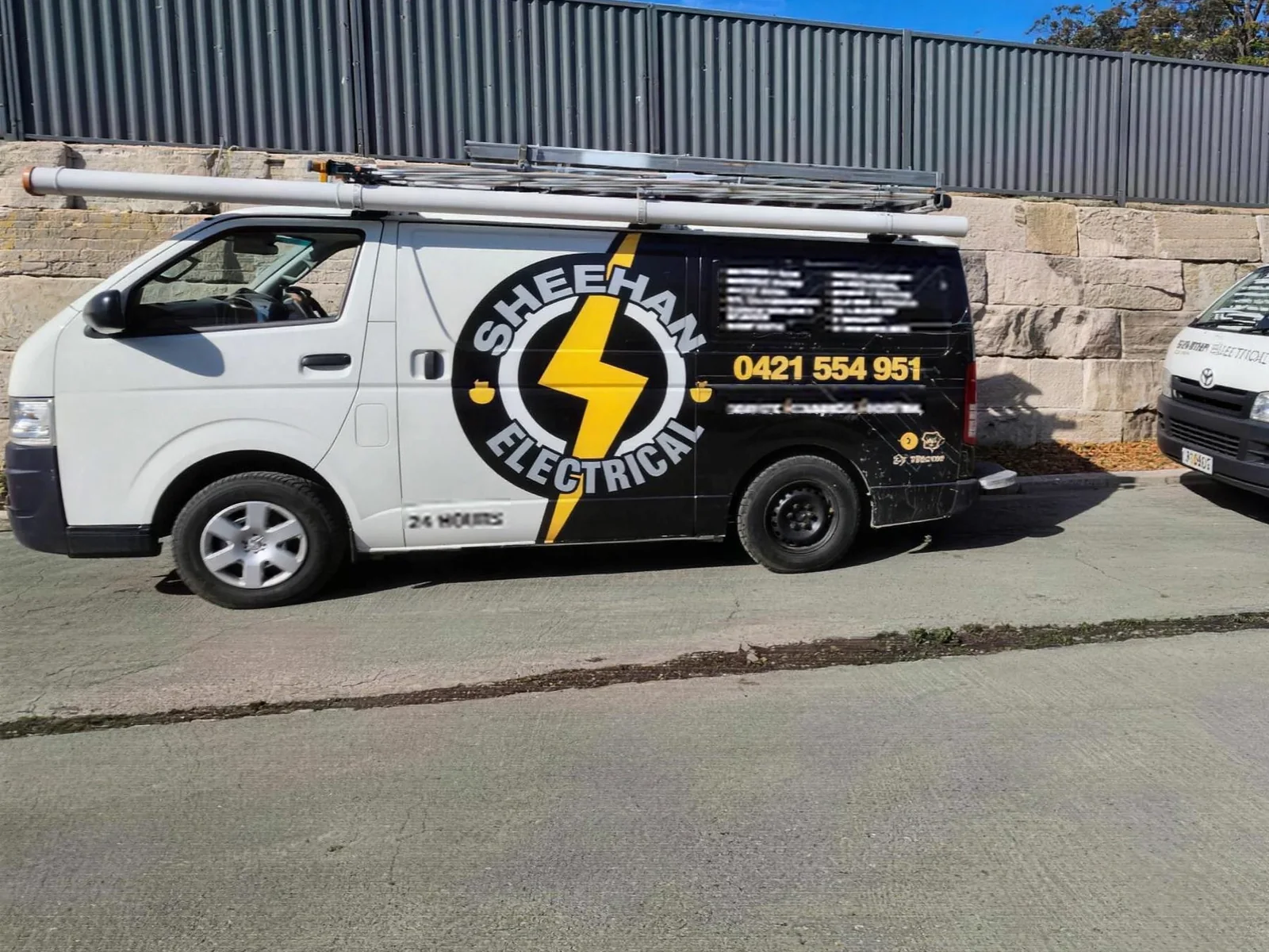 Two signwritten Sheehan Electrical vans, both stocked and on the road