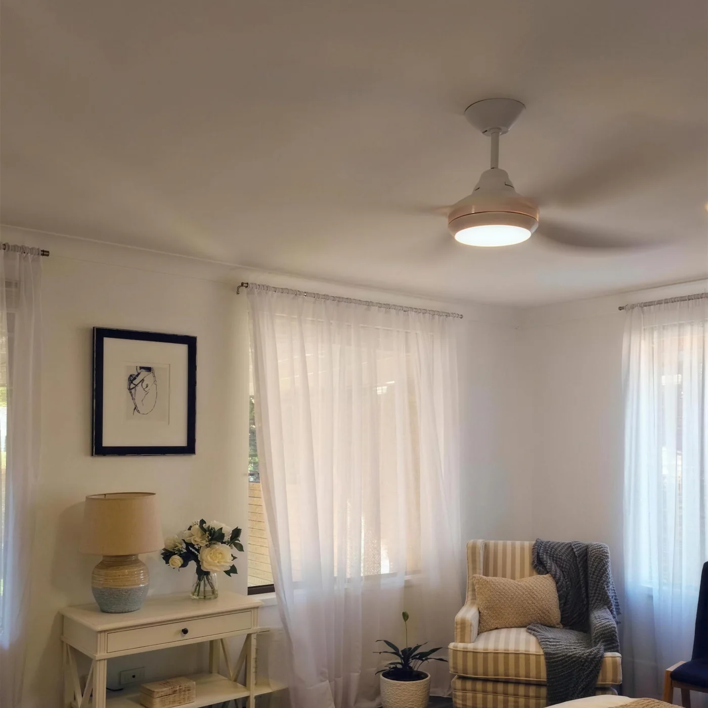 A bedroom ceiling fan and light fitted to a white ceiling