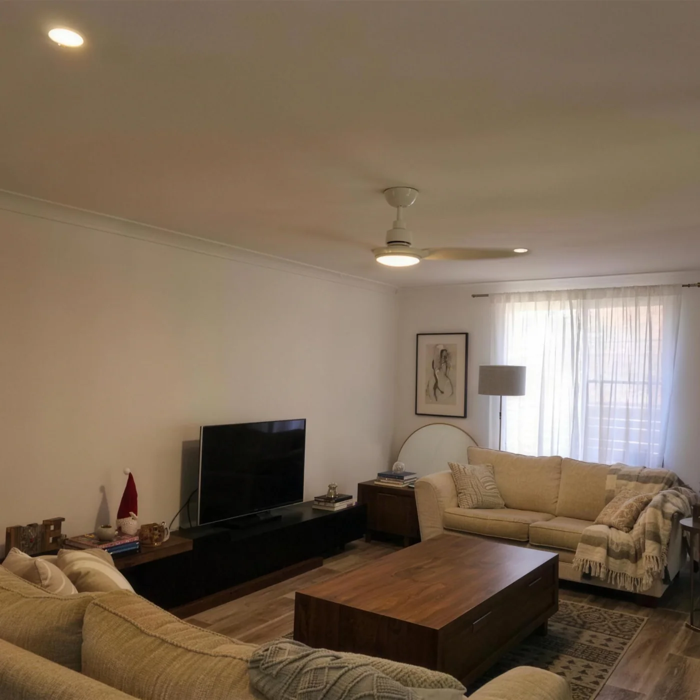 A Port Macquarie lounge room finished with LED downlights and a ceiling fan